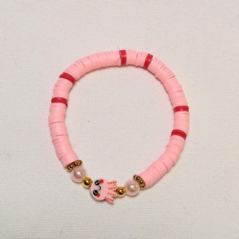 an adorable octopus with pink clay beads and pearl and gold accents