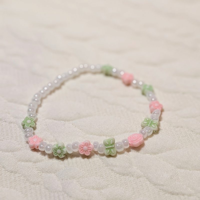 Dainty pearly white beads with green and pink flower and butterfly beads