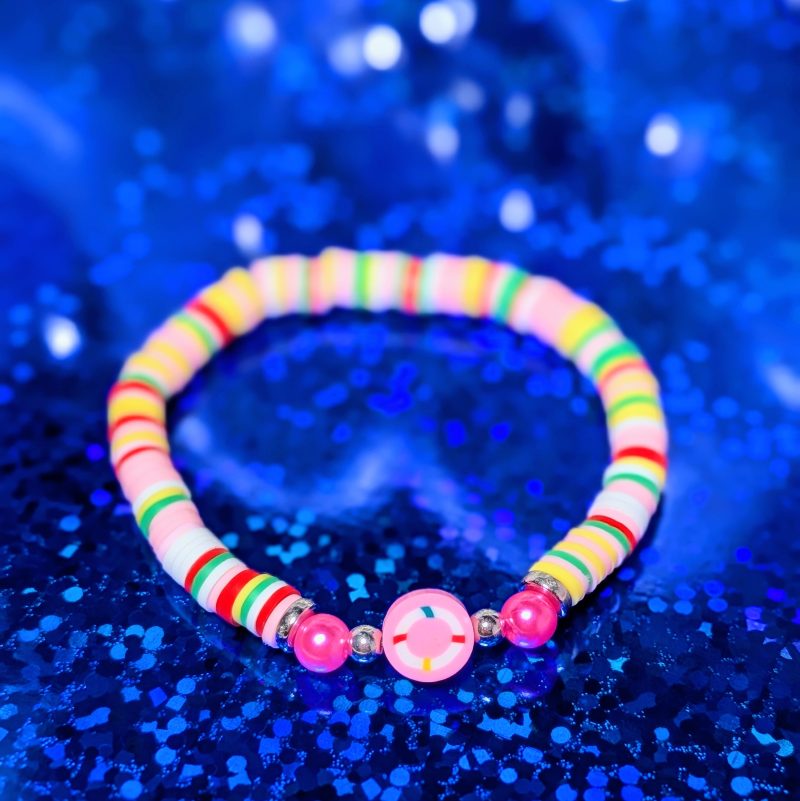 A nautical buoy centrepiece surrounded by clay beads, silver spacers, and pink accent beads — view 2
