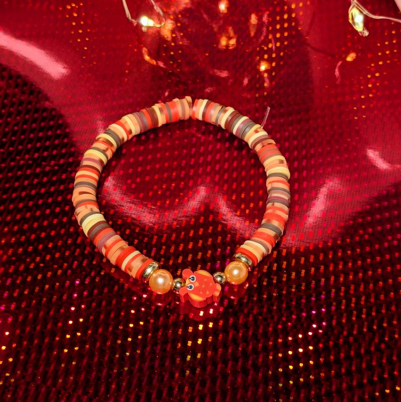 A centrepiece red and orange owl withclay beads, orange accent beads and gold spacers — view 3
