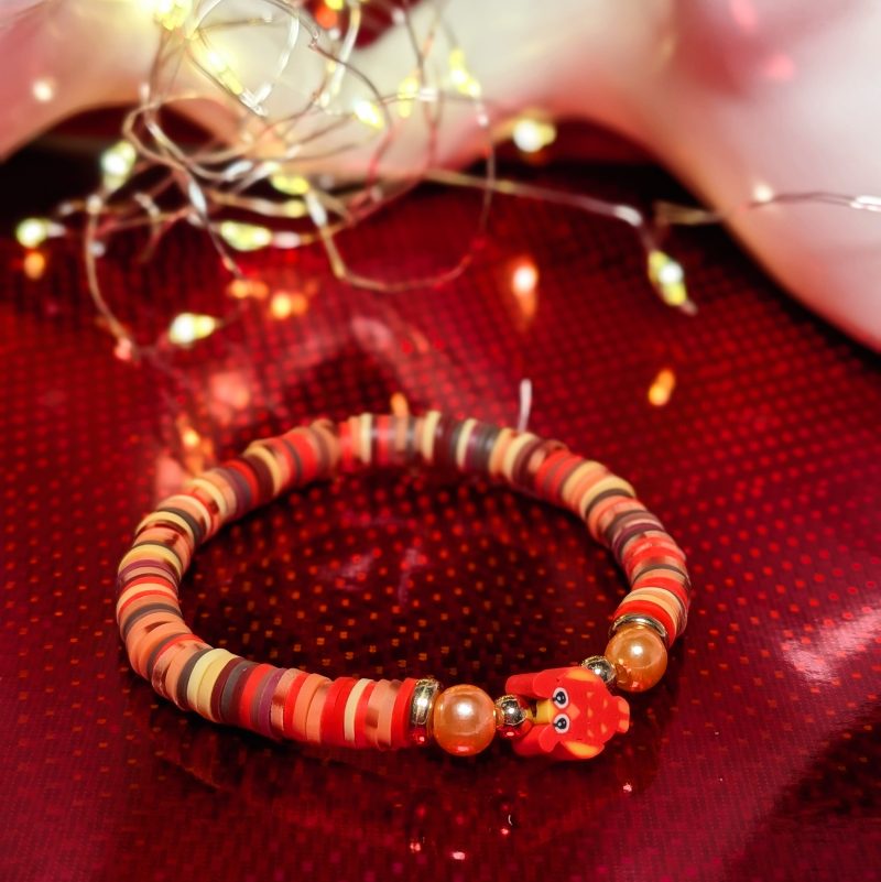 A centrepiece red and orange owl withclay beads, orange accent beads and gold spacers — view 2