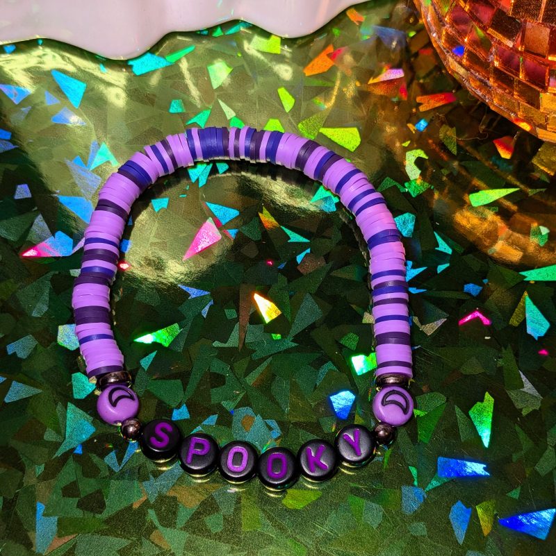Halloween friendship bracelet that spells spooky with moon beads and mixed purple clay beads — view 3
