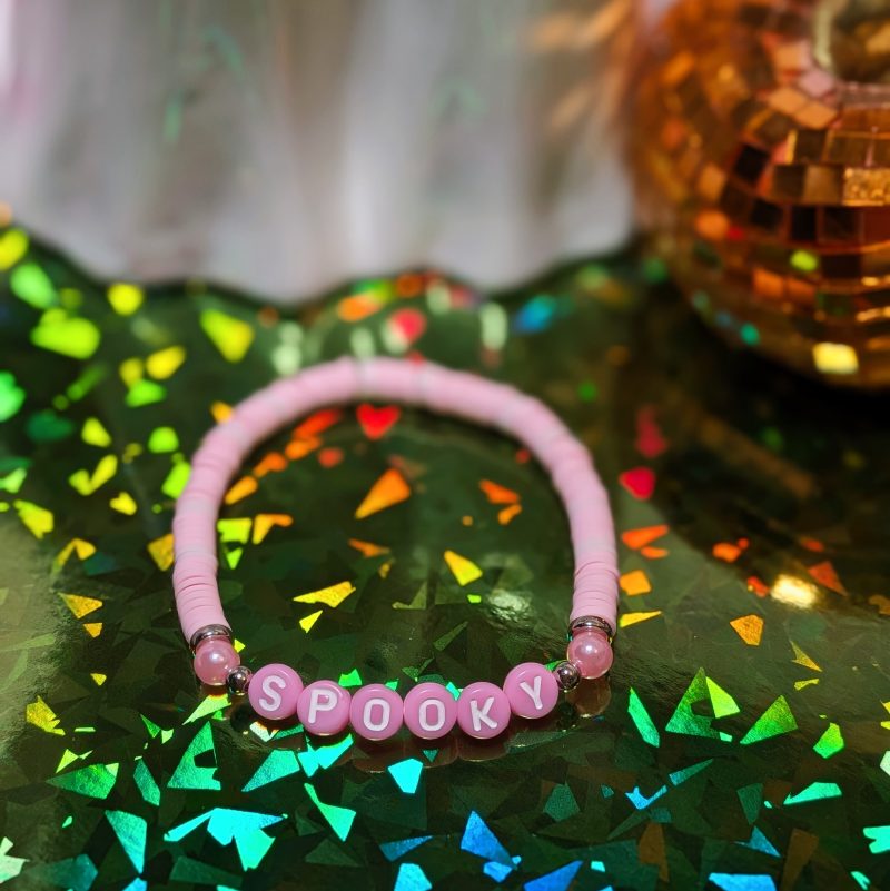 friendship bracelet that spells spooky with pink and light pink beads — view 2