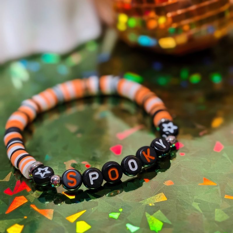 Halloween friendship bracelet spelling spooky with mixed orange white and black beads — view 2