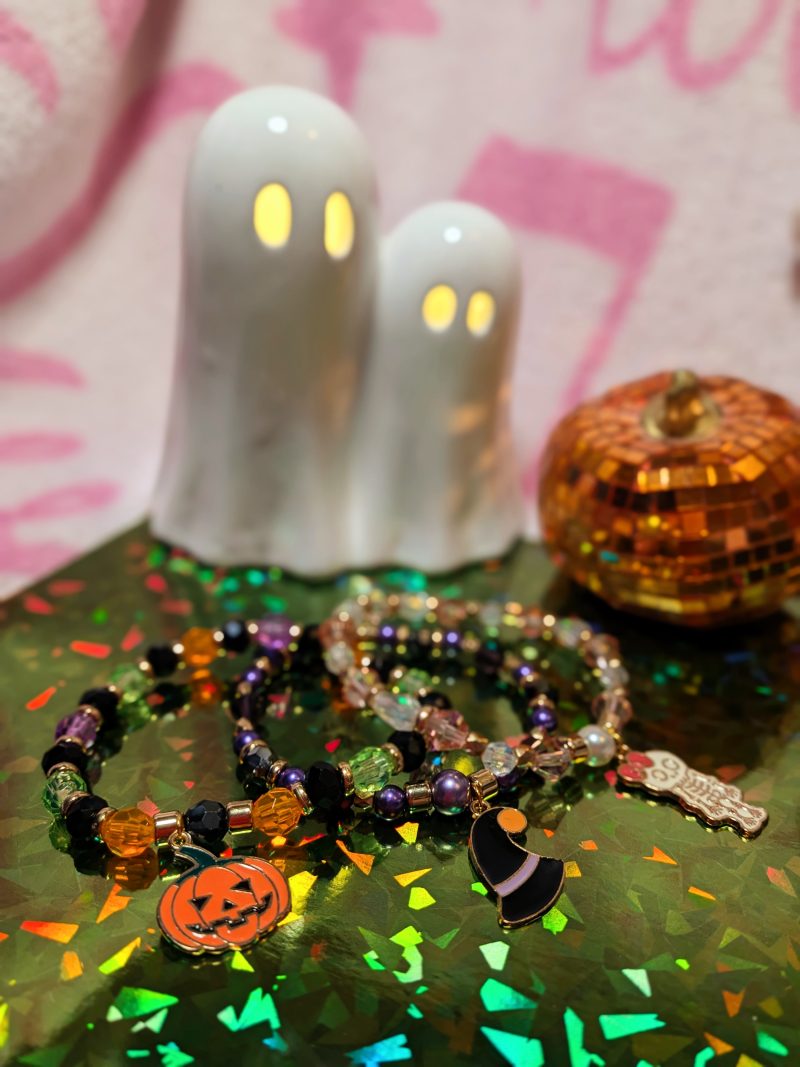 Halloween friendship bracelet with a witch hat charm. Gold accent spacers and beads in black and purple — view 5